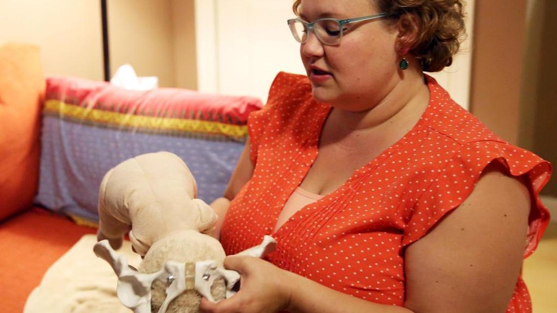 Doula Maria Stevens, owner and founder of State College Doula, meets with a client on July 3 in State College.