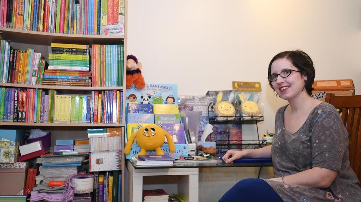 Marissa Leonard Smith, organizer of For Moms, By Moms events, poses on Oct. 16. for a portrait in her office. Leonard Smith sells Usborne Books at the events.