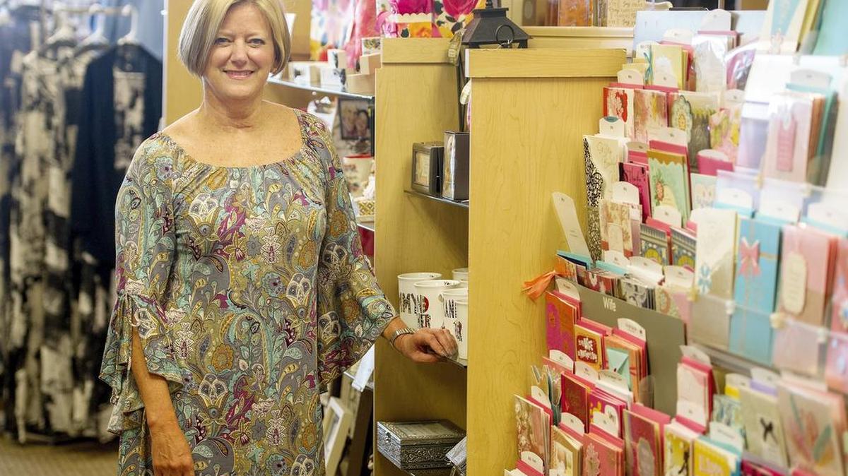 Barbara Grappone of Barbara’s Hallmark Shop stands among the Mother’s Day section of the shop in State College.