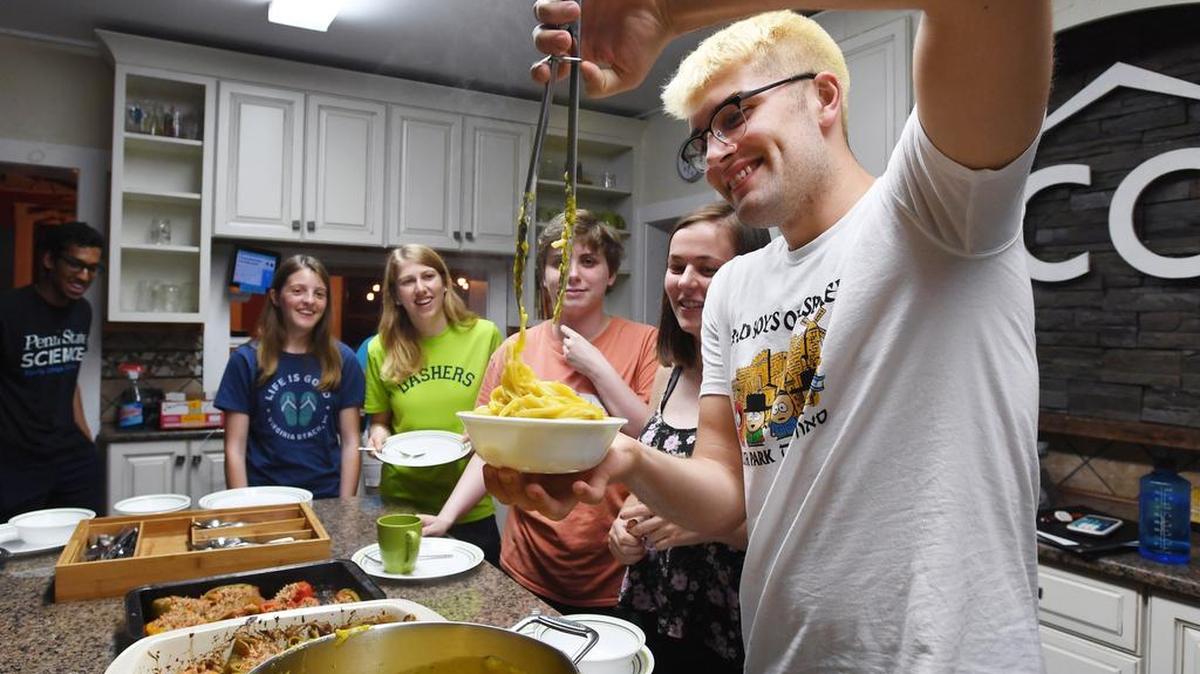 Penn State sophomore Clay Sulby gets some pasta during a family dinner on Sept. 24 at the co.space.
