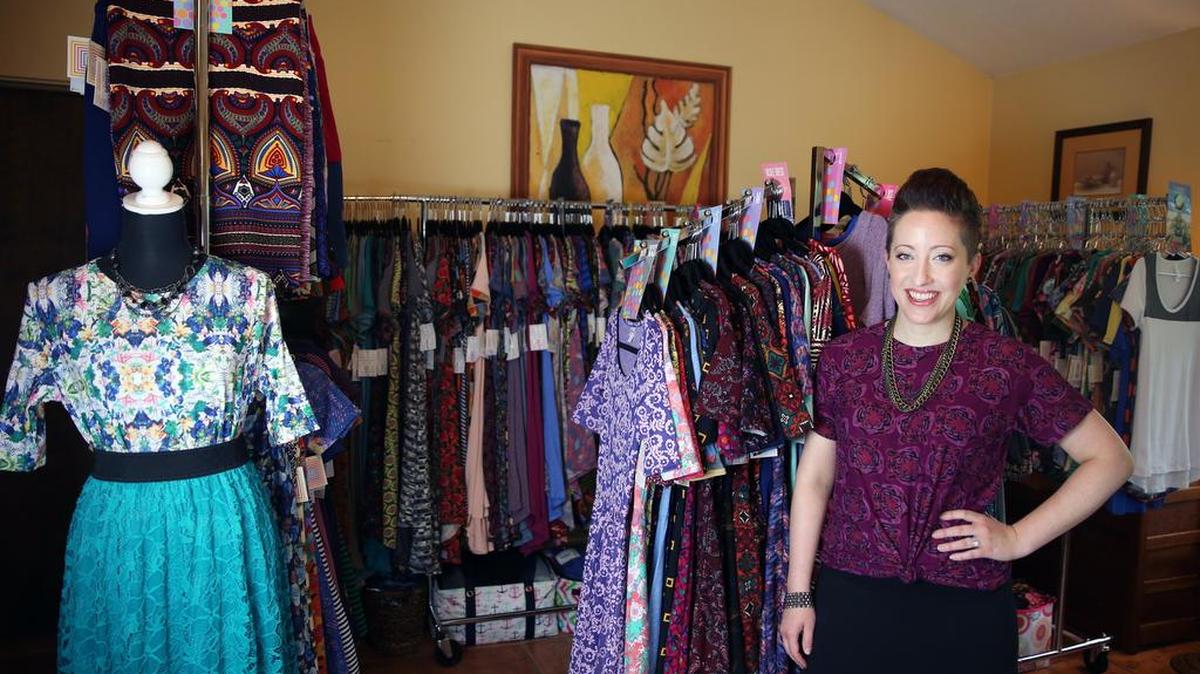 LuLaRoe independent retailer Lindsay Keegan stands for a portrait Tuesday in the room where she stores her clothing inventory in State College.