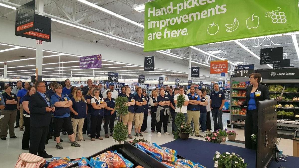 Crowds gather Friday as store Manager Lexie Meraglia officially opens the newly remodeled Wal-Mart Supercenter on North Atherton Street