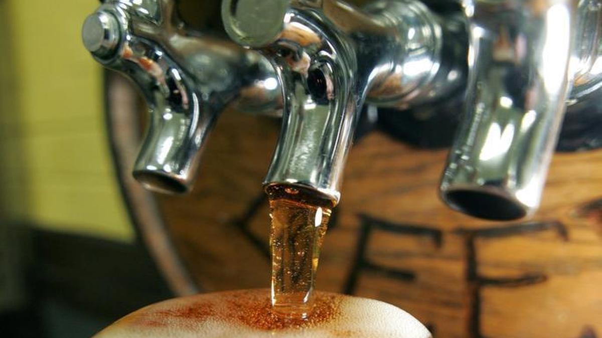 Federal Taphouse is a full service restaurant and bar that features 100 craft beers.
