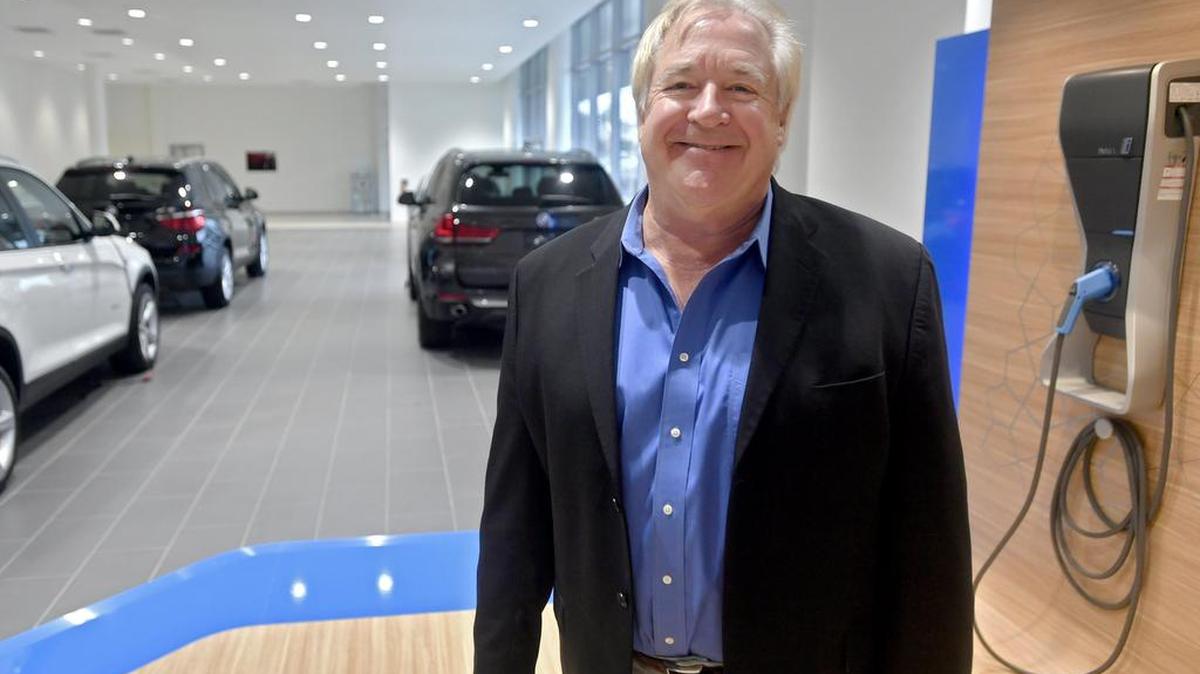 Ron Rehmeyer, the general manager of Joel Confer Toyota/BMW/Scion in State College, poses in the newly renovated building.