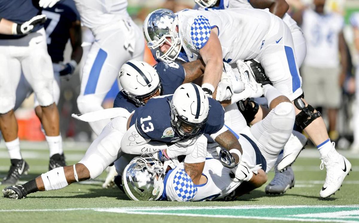 Kentucky’s ball carrier is stopped by Penn State linebacker Ellis Brooks during the Citrus Bowl on Tuesday, Jan. 1, 2019 at Camping World Stadium.