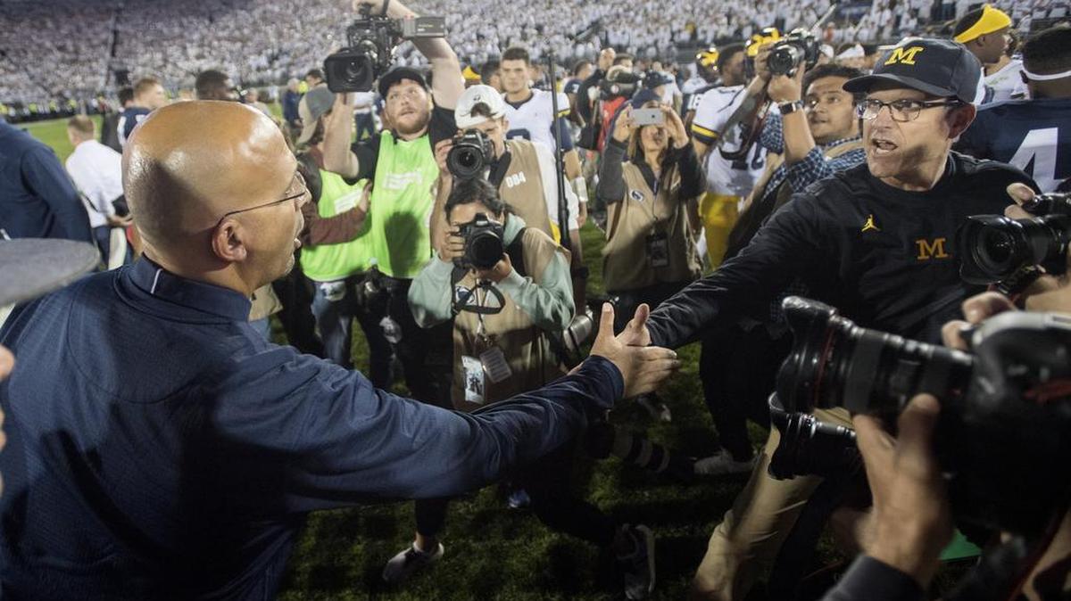 Penn State football coach James Franklin and Michigan head coach Jim Harbaugh shakes hands after the Nittany Lion win on Saturday, October 21, 2017 game at Beaver Stadium.