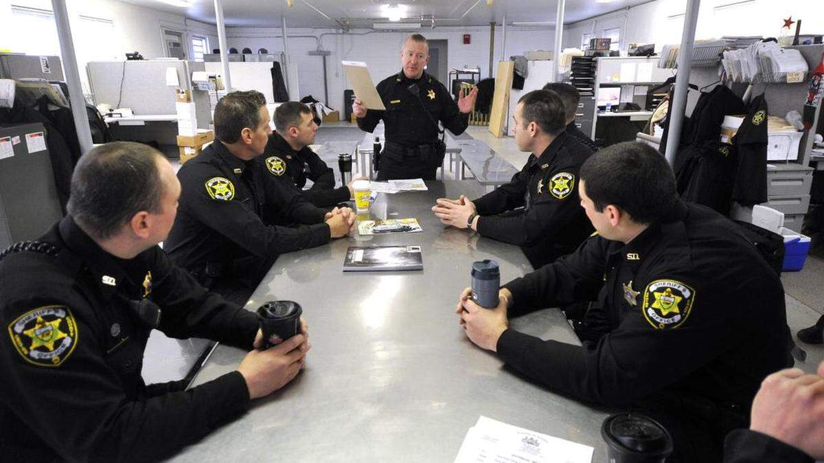 The Centre County Sheriff's Office is participating in a pilot program that checks in on the well-being of older residents who live alone. Sheriff Bryan Sampsel, center, said participants will regularly get an automated phone call from the sheriff's office asking them to press a button to signal that they're OK.