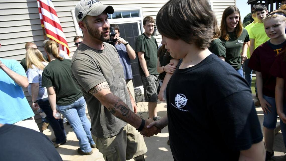Vince Reynolds shakes the hands of the CPI students who helped build the patio. Army veteran Vince Reynolds received a new patio at his State College home as part of the Heroscape Patio for a Patriot program May 27, 2016. CPI students designed and build the patio through EP Henry, a New Jersey-based company.