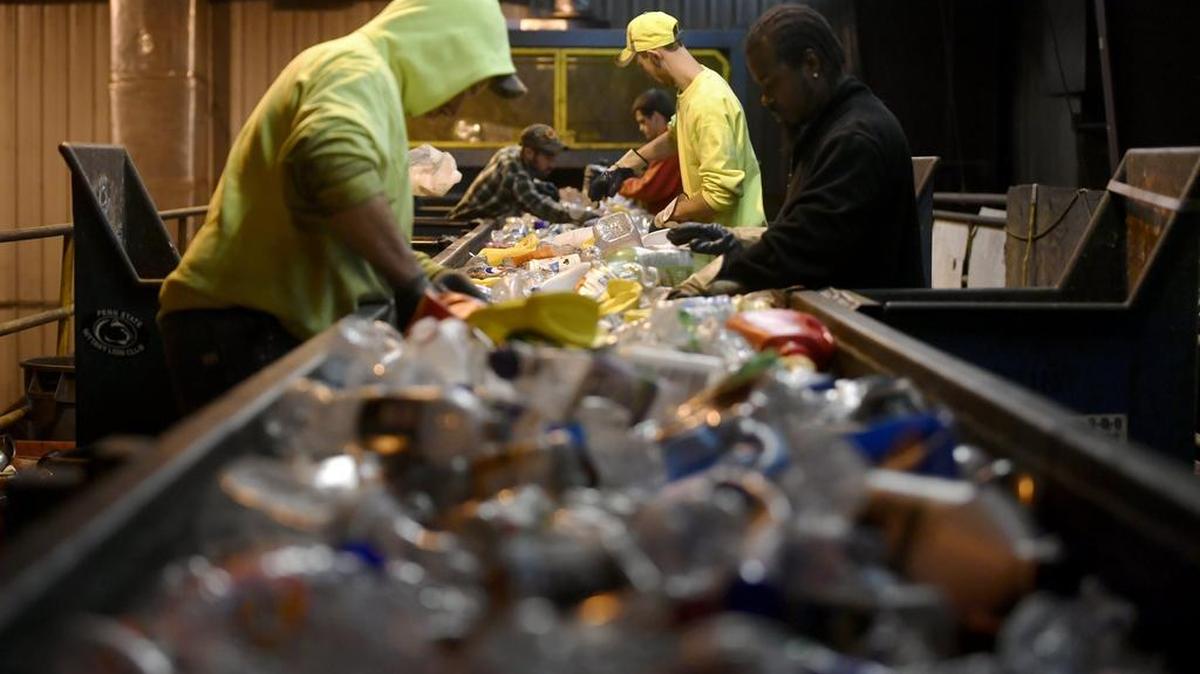 Workers double check and sort plastic at the Centre County Recycling & Refuse Authority on Wednesday. Plastics are double and triple checked for trash and other materials.