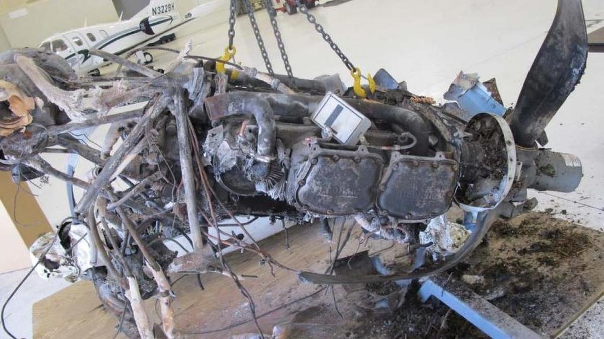 The left engine of the Piper PA-31 sustained significant fire damage in the crash.