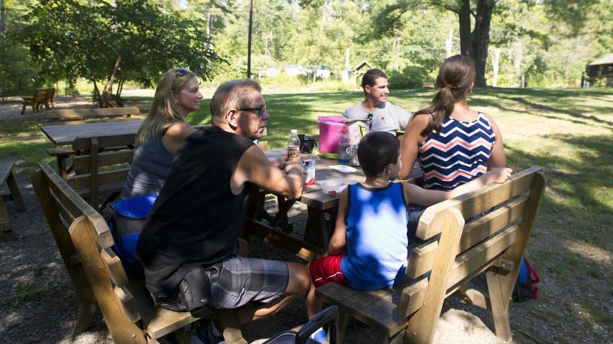 The Boland and O’Neill family have a picnic at Shaver’s Creek Environmental Center on Monday in Petersburg.