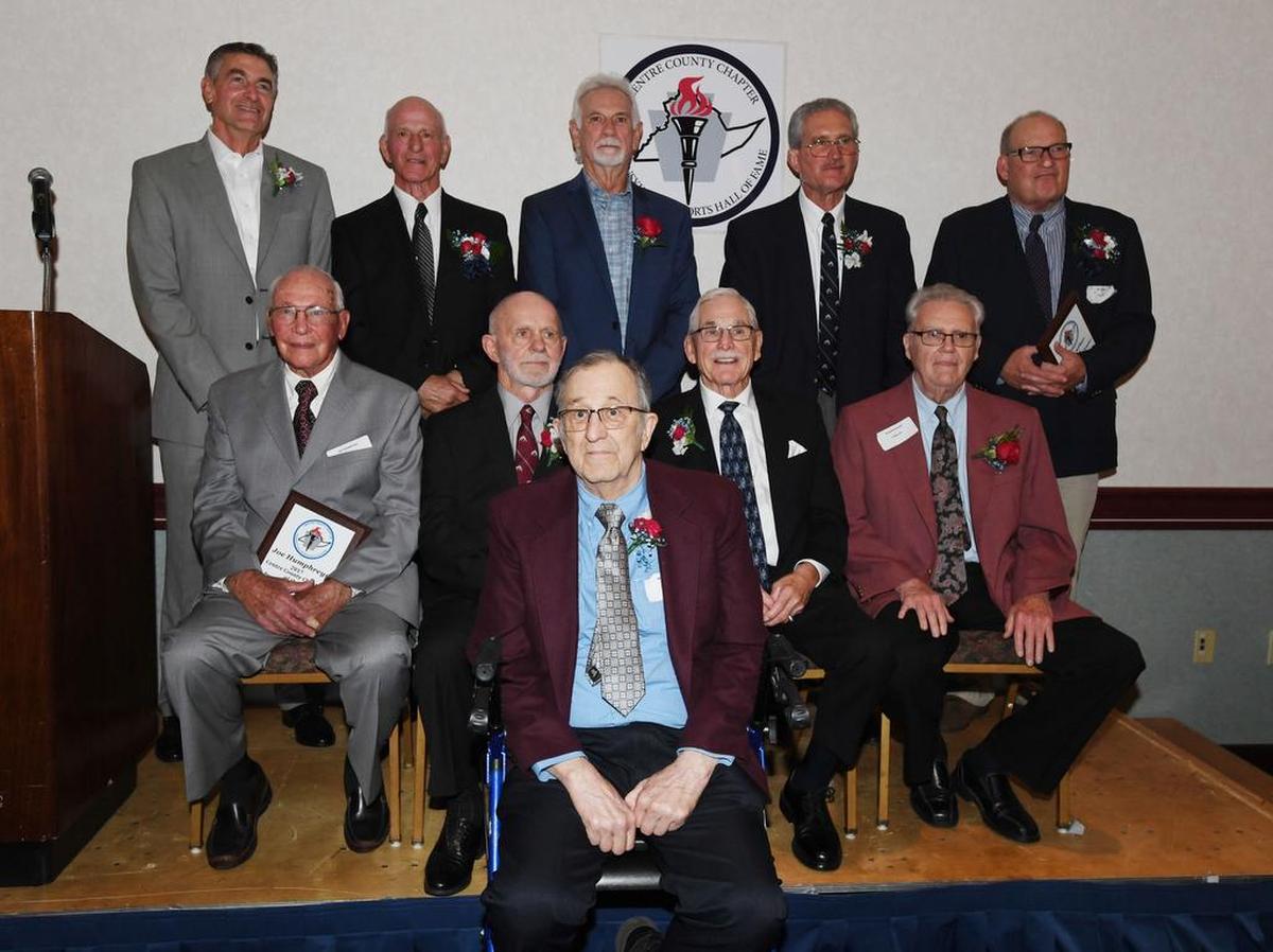 The Centre County Sports Hall of Fame inductees pose for a group portrait Sunday. They are, from left to right in the top row, Bruce Parkhill, Thad Turner, Danny Leathers, Rich Lorenzo and Bill Luther Jr. (representing his father Bill Sr.). Middle row, from left to right, are Joe Humphreys, Joe Hammaker, Dave Adams and Doug McDonald. Ward Whitehill is in the front row.