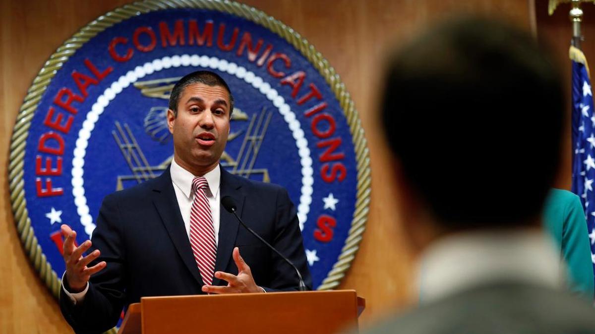 After a meeting voting to end net neutrality, Federal Communications Commission Chairman Ajit Pai answers a question from a reporter on Dec. 14 in Washington.