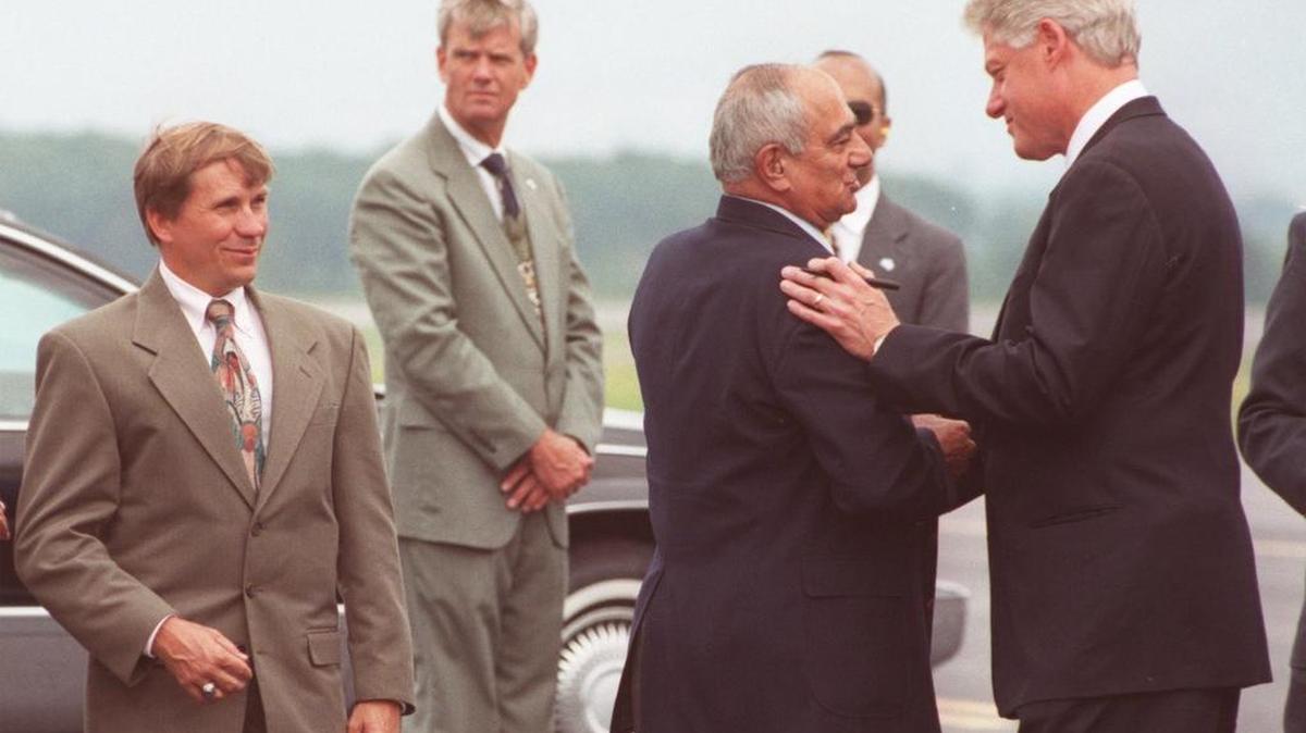 President Bill Clinton shakes hands with Bud George after arriving at University Park Airport in July 2000. George, a longtime local legislator, died Friday.