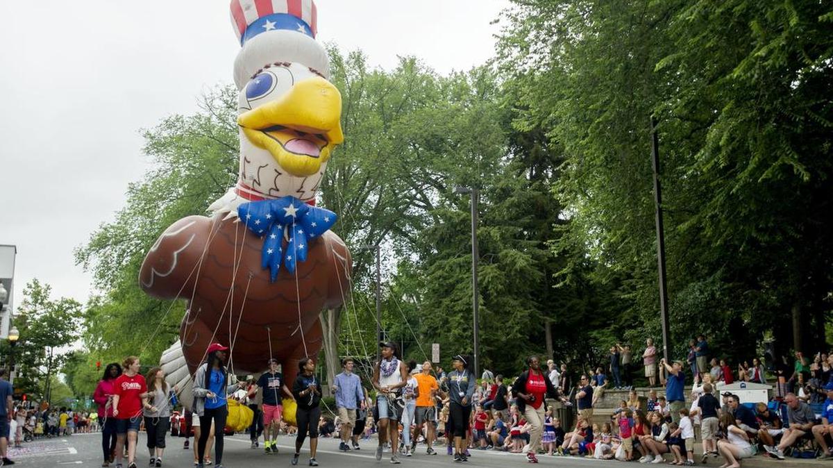 A balloon eagle makes its way down College Avenue during the Central PA 4th Fest Heroes Parade on Monday.