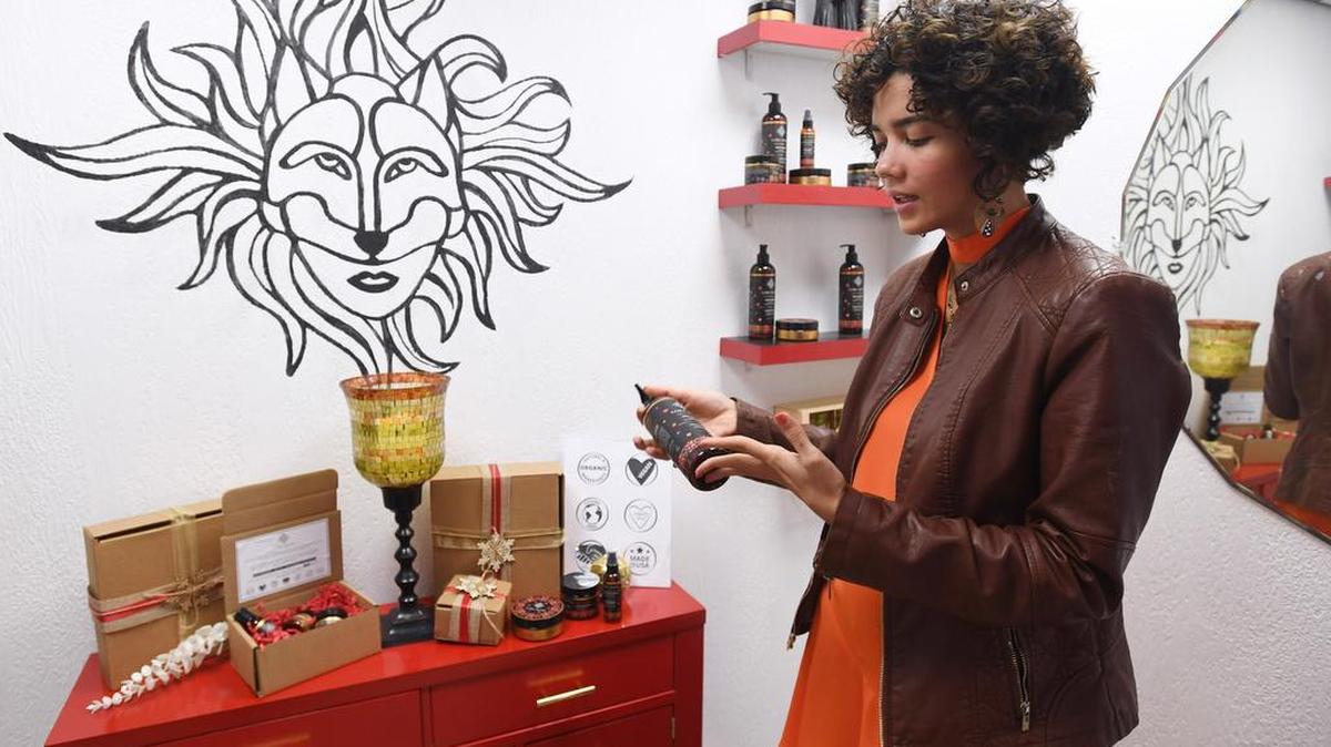 Loba Mana co-owner Heidi Pernett describes the ingredients of the company’s hair products on Dec. 16 at Linda’s Beauty Care in Pleasant Gap.