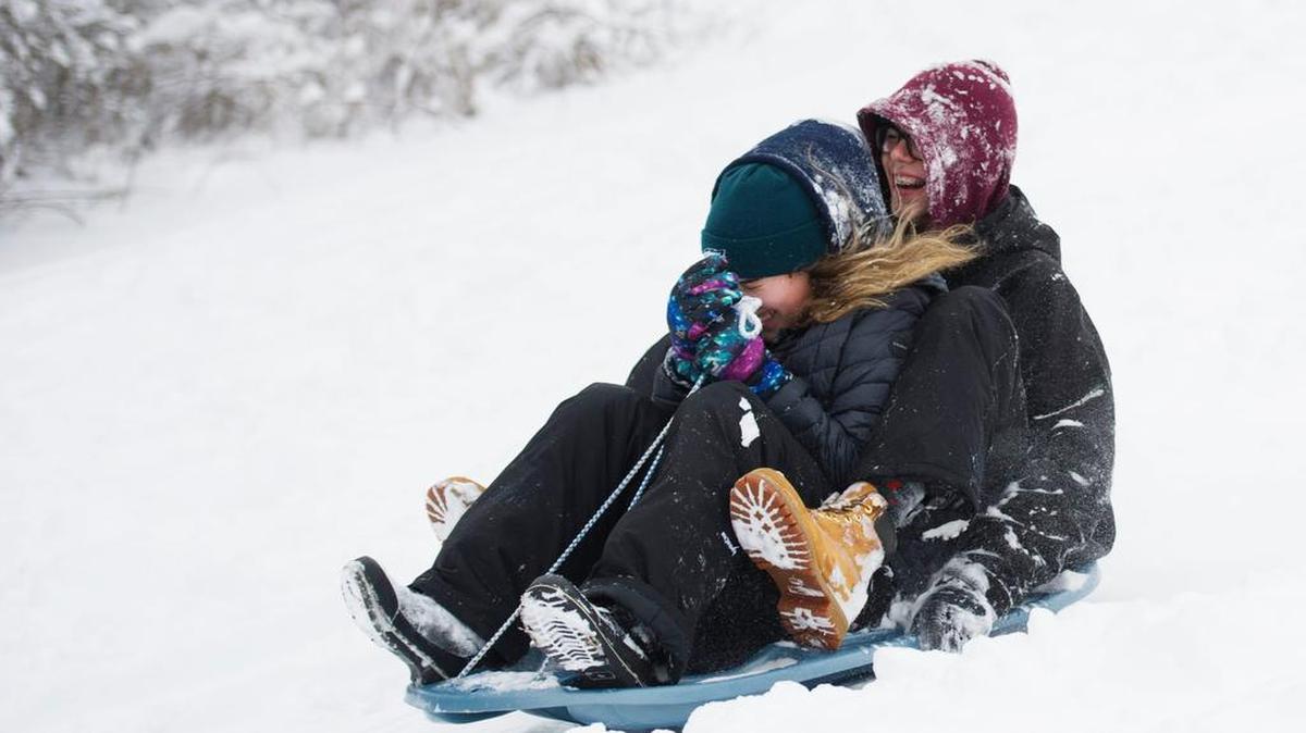 Sara Conklin, 15, and Dennis Rohan, 16 sled during their snow day Thursday, Feb 9, 2017 at Slab Cabin Park.