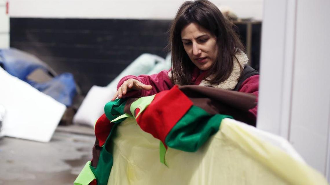 Director of The Friendly Cities Lab Clio Andris works on decorating a prop for the busses Friday, Oct 28, 2016 in Milesburg.