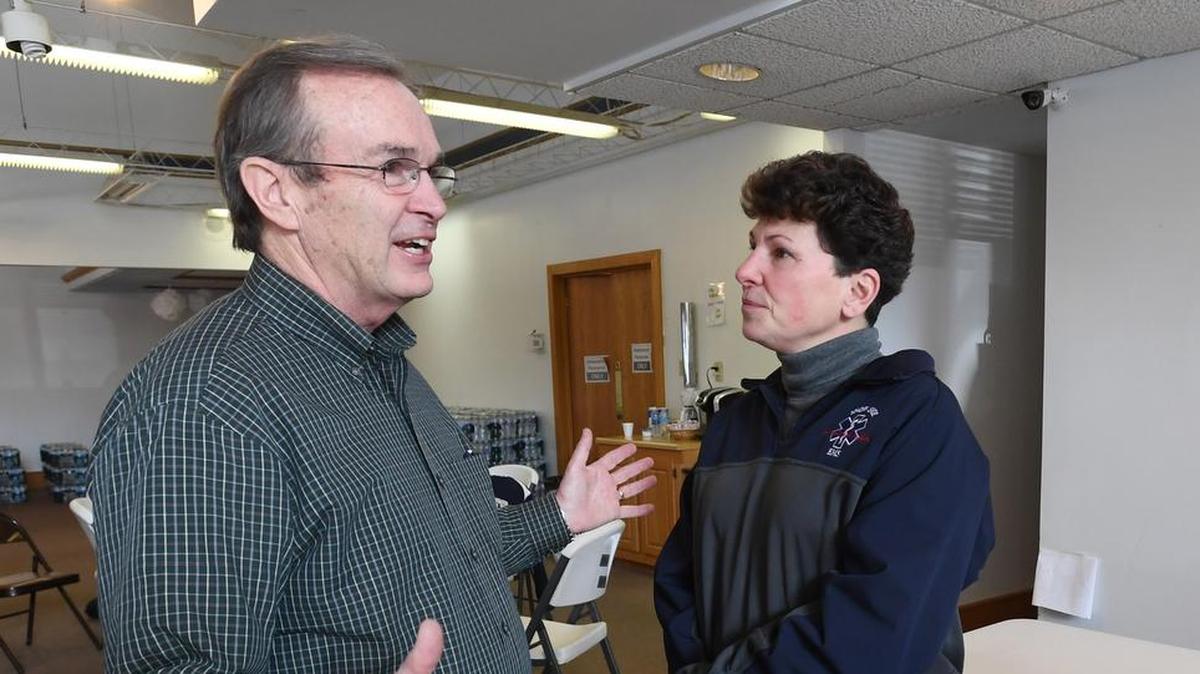 State Rep. Mike Hanna speaks with EMS Chief Sharon Nilson during a water donation on Jan. 19 at the Snow Shoe EMS.
