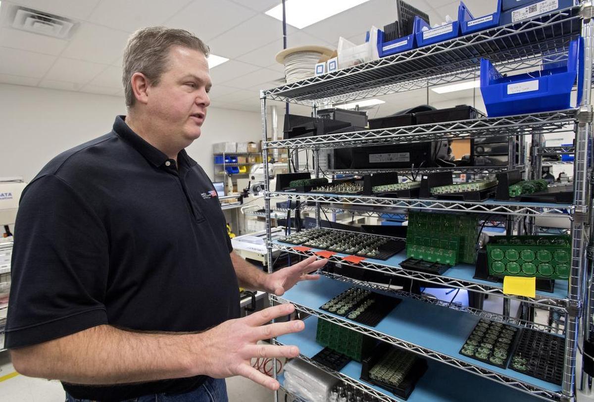 John Bonislawski, president and CEO of Homeland Manufacturing Services Inc., talks in January about the circuit boards the company makes.