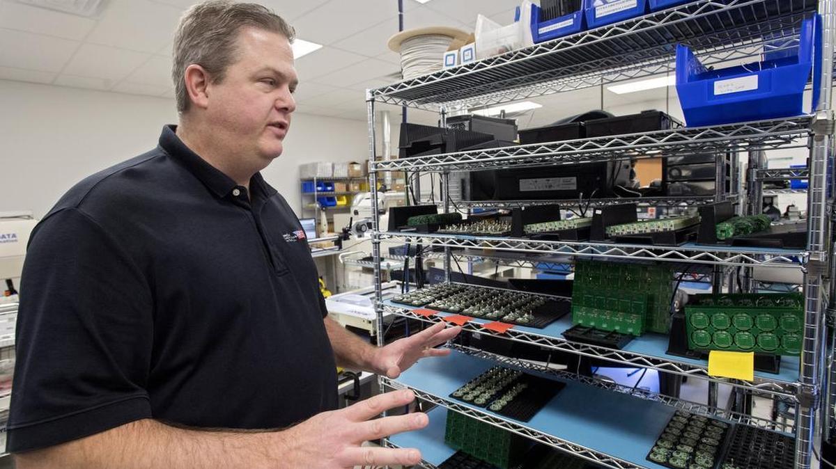 John Bonislawski, president and CEO of Homeland Manufacturing Services Inc., talks in January about the circuit boards the company makes. HMS plans to build a new facility in the Benner Commerce Business Park.