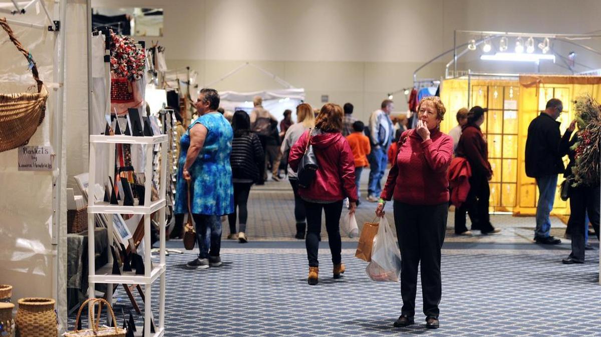 People browse the various vendors during the Winter Craft Market Saturday, Dec. 2, 2017 at the Penn Stater.