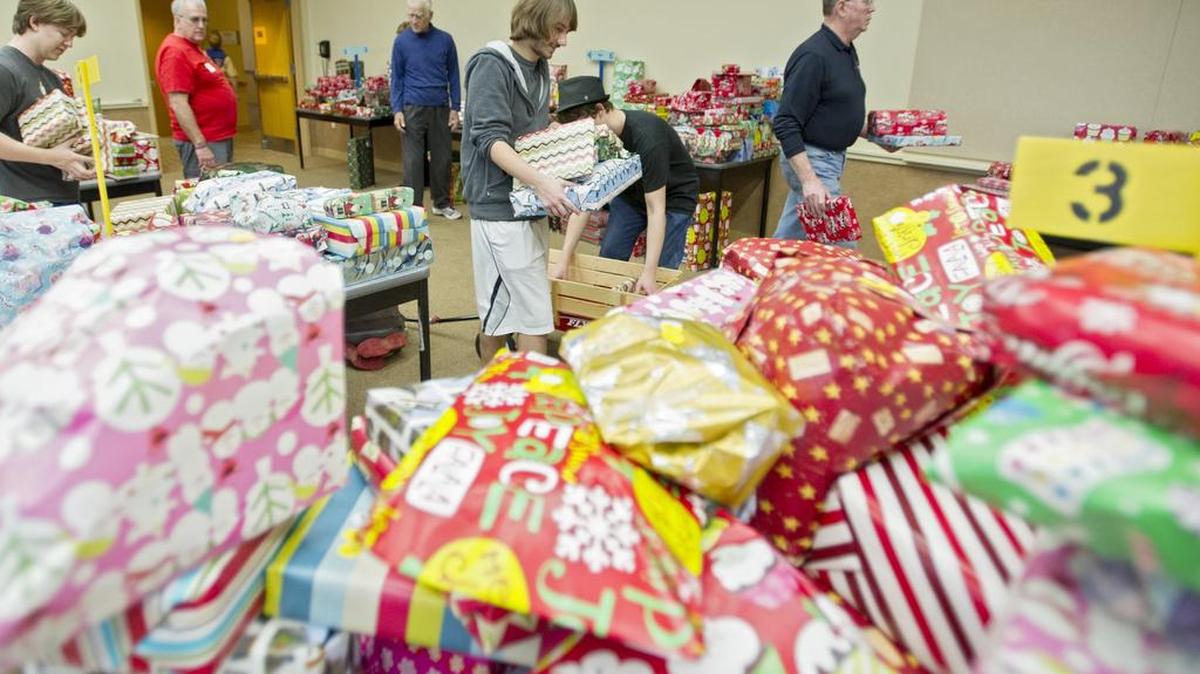 Clayton Terrizzi helps to organize the wrapped toys for Toys for Tots at the Penn Stater Hotel and Conference Center in 2015.
