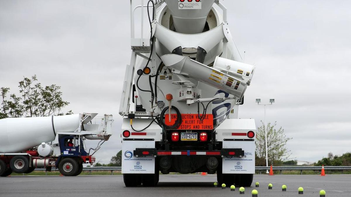 Rob Gordon, of Masters Ready Mix Concrete, drives a cement truck through a row of tennis balls during the Mixer Driver Rodeo Championship on Saturday at the Centre County Public Safety Training Center.