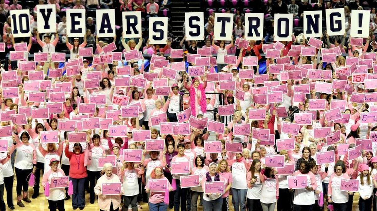 Halftime at the Lady Lions’ 10th Annual Pink Zone game honored 640 cancer survivors on the court during on Sunday. They held signs showing how long they’ve been cancer free.