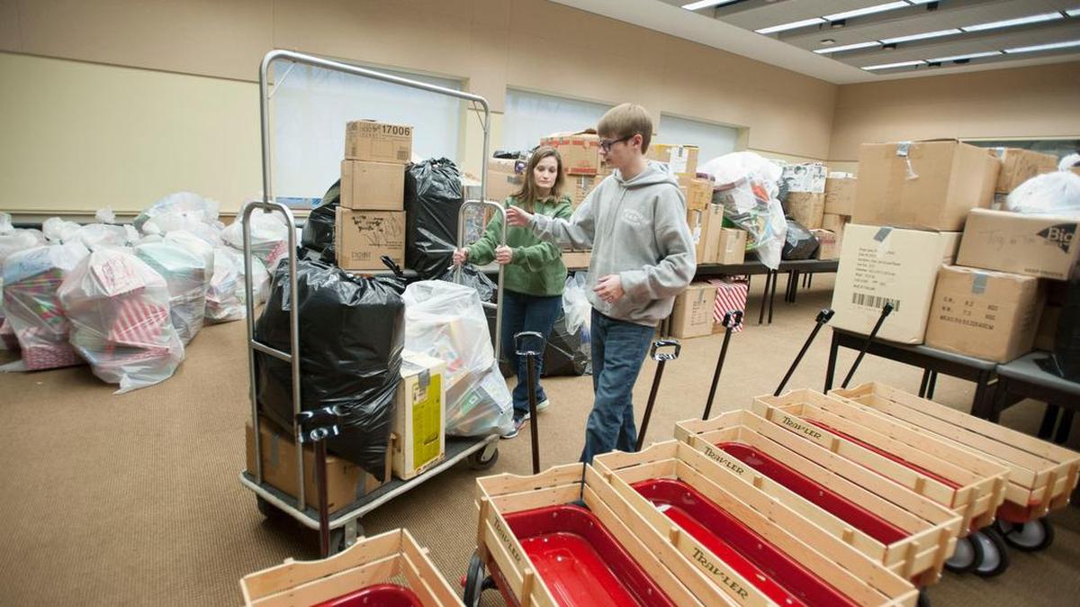 Shelby Foster and Collin Foster, 15, organize bags of toys as the Centre County Toys for Tots campaign came to a close Sunday at The Penn Stater Hotel and Conference Center.