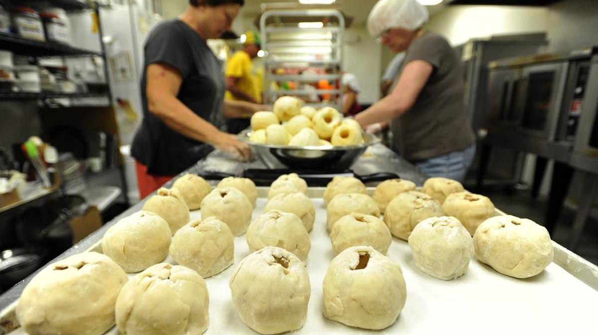 Volunteers prepare apple dumplings at Way Fruit Farm in 2013 to be sold at the farm’s fall festivals.