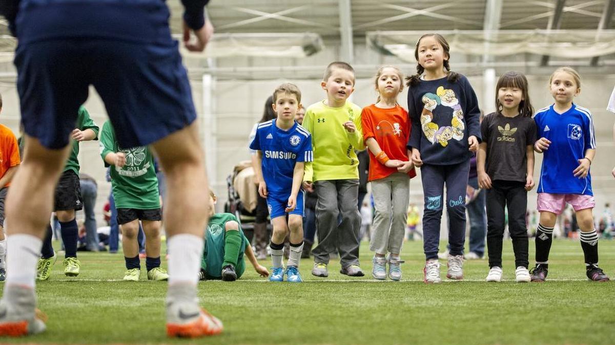 Penn State’s Kyle MacDonald leads 5- to 7-year-old soccer players in a game during the fourth annual Mack Brady Soccer Clinic at Holuba Hall on Saturday. The clinic doubled as a 12th birthday celebration for Mack, who died three years ago.