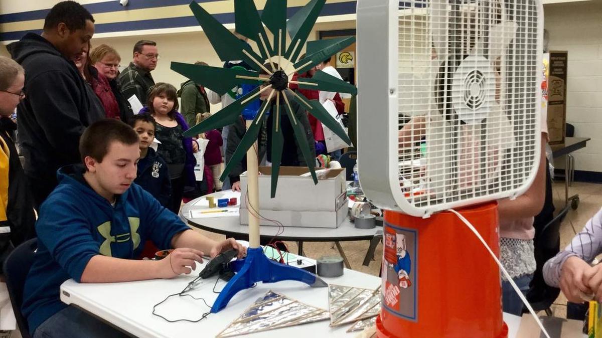 Bald Eagle Area eighth-grade student Dylan Roberts operates a windmill he made with a group of classmates. It was showcased at a science fair at the high school Thursday night. The project will be entered in the KidWind Challenge competition March 19.