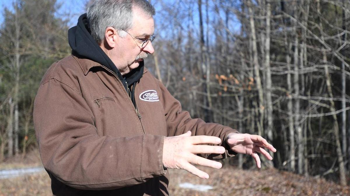 Mountaintop Regional Water Authority Chairman Jim Yost talks about water levels Friday at the German settlement tank in Burnside Township.