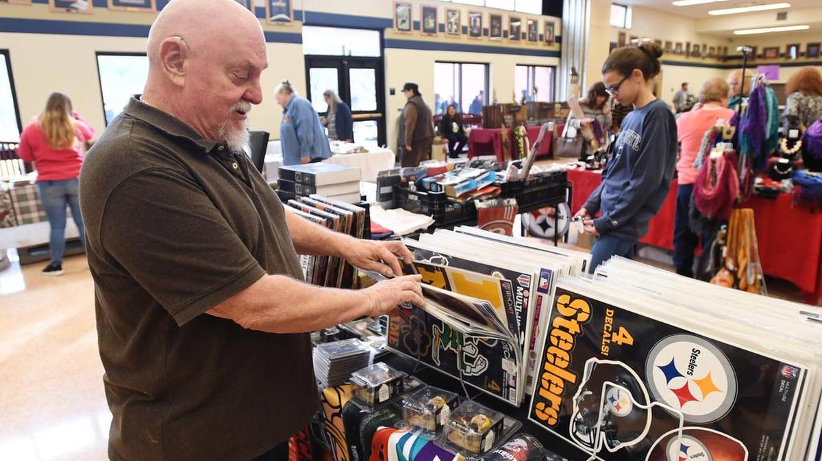 Mike Anthony talks about various items he sells during the craft fair Saturday at Bald Eagle Area High School.