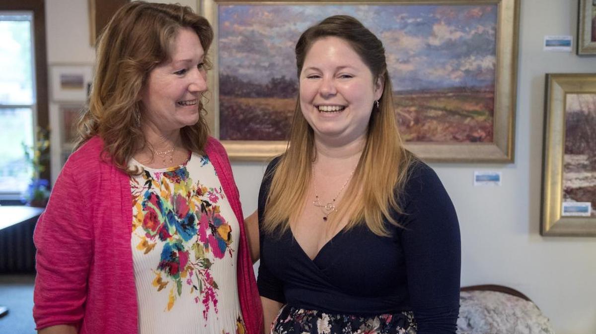 Artists Susan Nicholas Gephart and her daughter Kaitlyn Rae Gephart laugh together during the Art Alliance Spring Tour on Sunday.