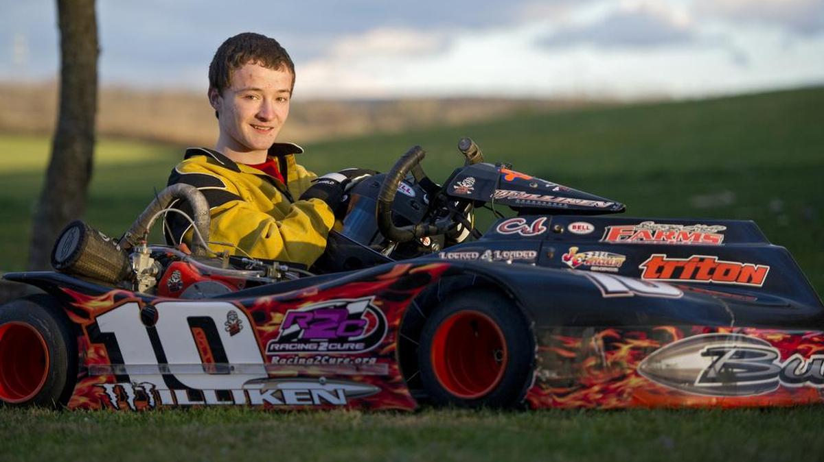 CJ Milliken sits in his go-kart outside of his home. Milliken dominates on the track and in his efforts to raise money for Racing 2 Cure.