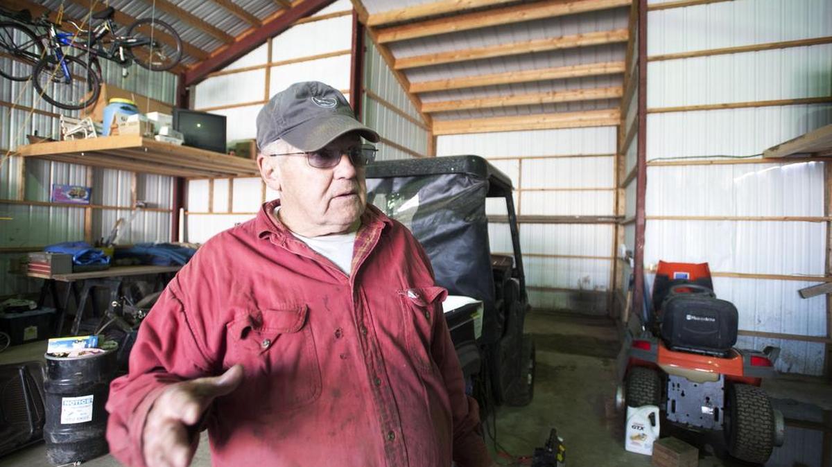 Tom Schivery, 72, speaks about the flood damage in his garage during a cleanup of the lower Coleville Area on Tuesday.