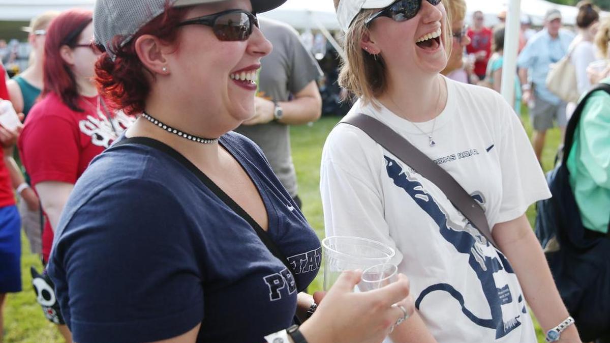 Erika Hoffman, left, and Vanessa Bower laugh as they test various beverages from Barrel 21 during Summer Craft Beverage Expo Sunday at Talleyrand Park in Bellefonte.