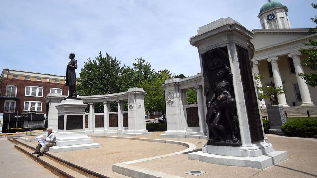 Gary Hoover sits on the steps in front of the Soldiers and Sailors Memorial and Curtin Monument outside the Centre County Courthouse in Bellefonte. The board of commissioners on Tuesday approved a contract to restore and preserve the more than 100-year-old monument.