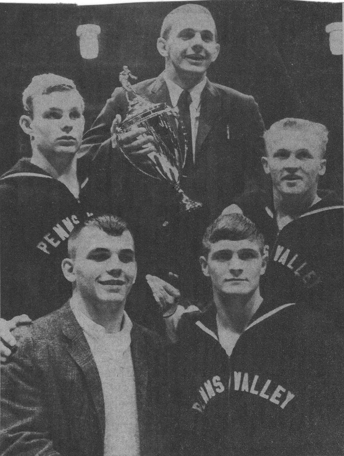 Pictured after winning the district title are Penns Valley wrestlers: bottom row, Barry Williams and Marty Ilgen; back, Jack Reigel, coach Joe Hammaker and Sam Reish.