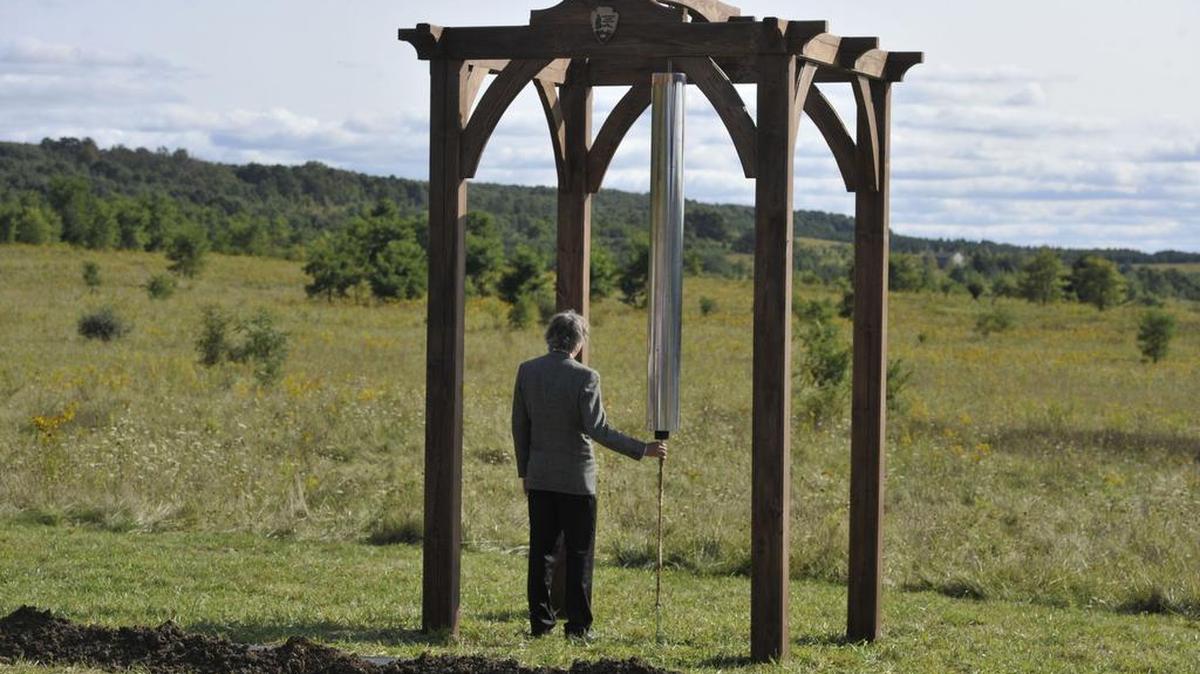 Architect Paul Murdoch rings on Sunday one of the 98-pound chimes that will be included in the Tower of Voices. The tower is being built to remember those who lost their lives on Flight 93 on Sept. 11, 2001.