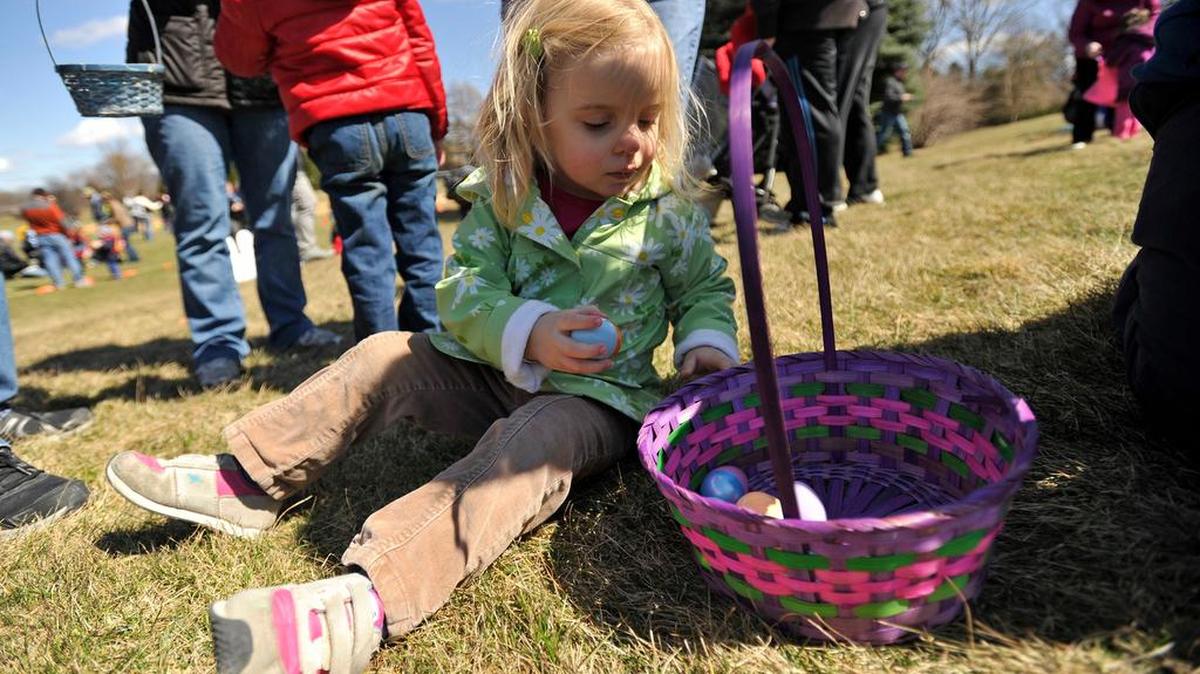Julie Ruff, 3, sorts eggs she collected during the Centre Region Parks and Recreation’s 57th Annual Easter Egg Hunt in Orchard Park in April 2015.