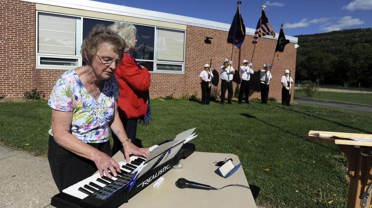 Nancy Jackson performs the national anthem during a 9/11 memorial service Sunday at the Port Matilda United Methodist Church in Port Matilda.