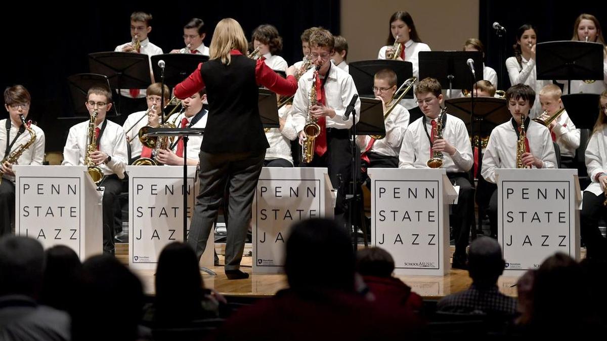 Edward Henry, 14, plays a solo on the alto saxophone with the Bellefonte Middle School Jazz band during their performance at the 18th annual Penn State Jazz Festival in Esber Recital Hall on Saturday.