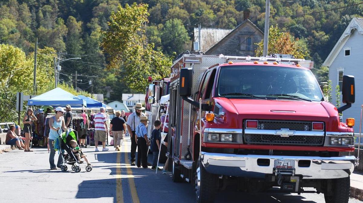 Attendees browse various stands during the Old Gregg School Raise the Roof Community Fest on Saturday at the Old Gregg School in Spring Mills.