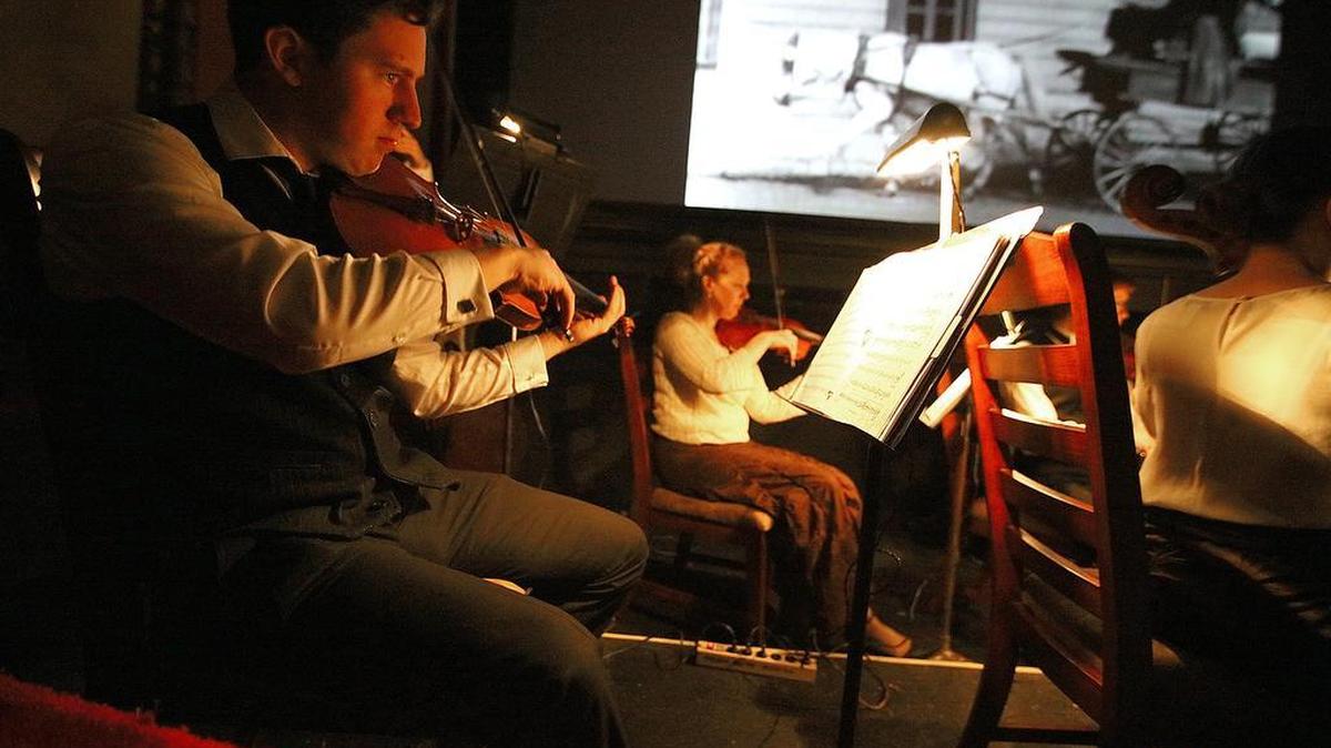 Members of the Paragon Ragtime Orchestra create the soundtrack to a Buster Keaton silent movie on Saturday night at the Rowland Theatre in Philipsburg. The event, called “The Clown Princes,” featured the work of Charlie Chaplin, Buster Keaton and Harold Lloyd.