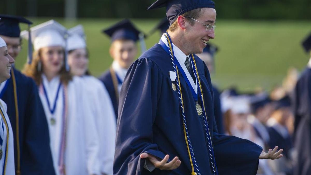 Philipsburg-Osceola valedictorian Kyle Albert leads the first group of students to receive their diplomas during the commencement ceremony on the school’s football field on Friday.