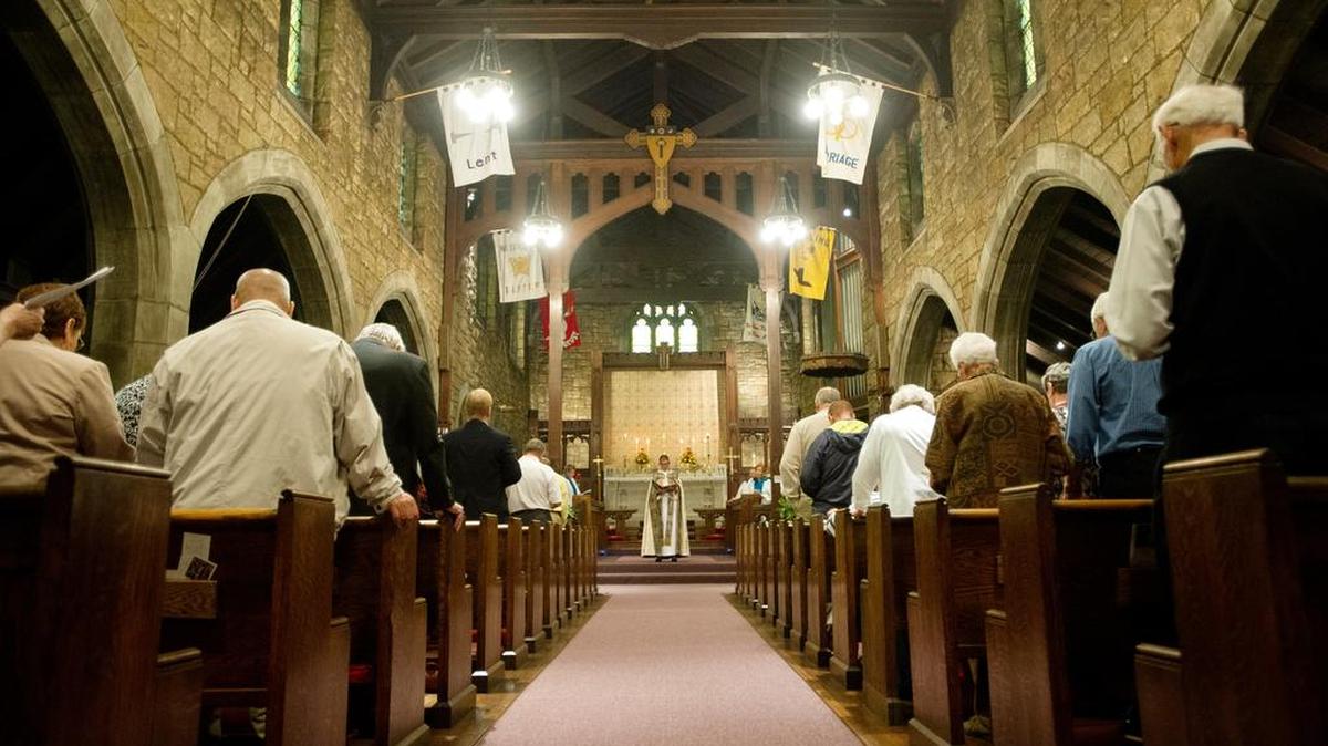 The Rt. Rev. Audrey Cady Scanlan, Bishop of the Diocese of Central Pennsylvania, reads from the gospel during a service in September 2015 at St. Paul’s Episcopal Church in Philipsburg.