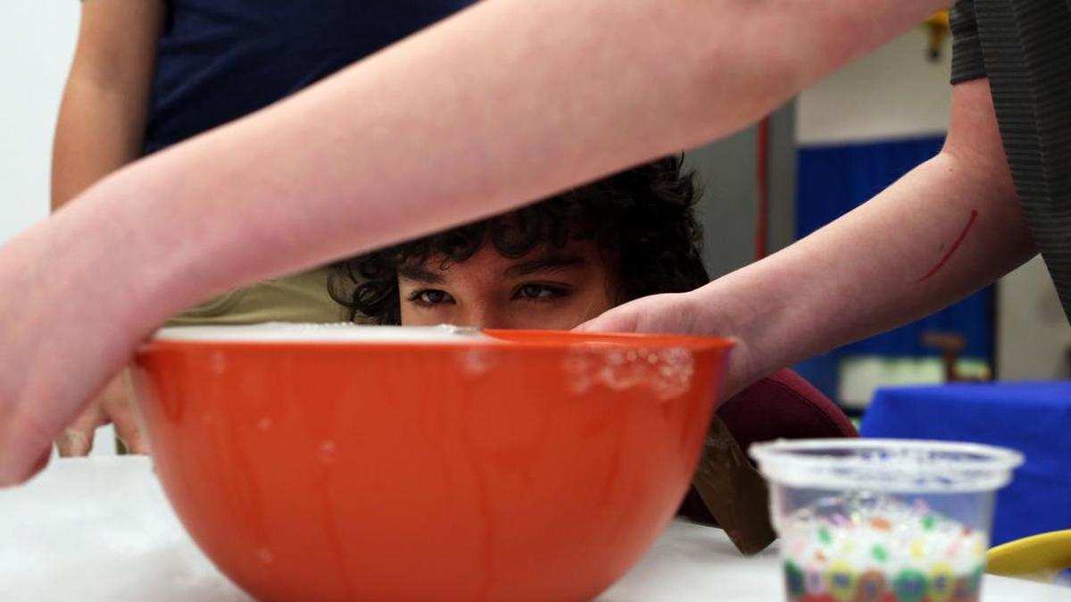 Diego Del Pilar watches a dry ice experiment during the Spooky Science Program Saturday at Discovery Space in State College.